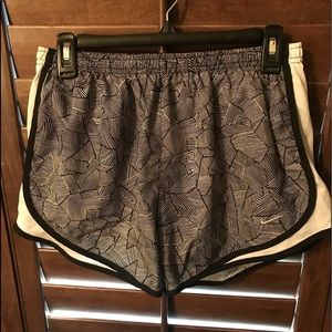 These are a pair of black and white nike shorts.